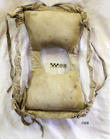Jacket us spread open showing shoulder straps and waist ties