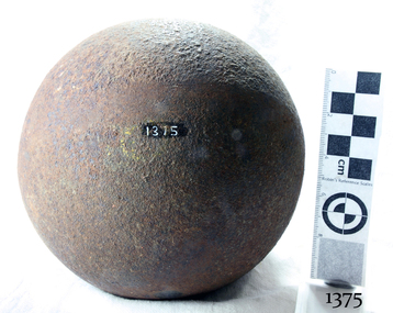 Round black iron ball with pitted surface