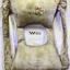 Inscriptions on front and back pockets, hole exposes kapok filling