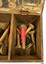 Compartment has several wooden cones of cotton thread