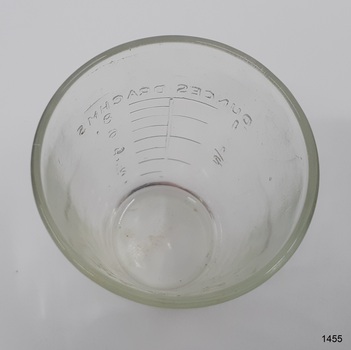 Inscriptions are embossed on the inside. Glass thickness is uneven and rippled.