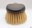 Brush tip has a row of holes indented around the curve
