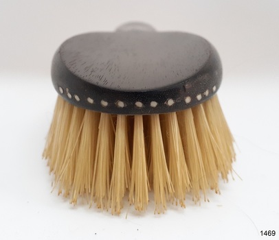 Brush tip has a row of holes indented around the curve