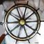 Wooden ship's wheel with brass fittings