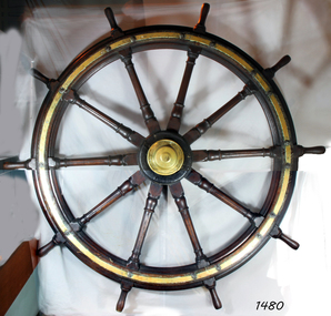 Wooden ship's wheel with brass fittings