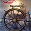 Large wooden ship's wheel with ten spokes