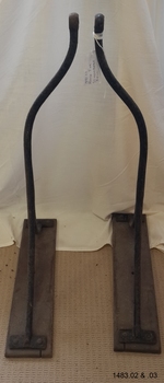 Stand is made of metal and wood
