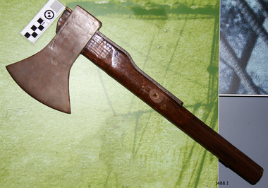 Wooden handle with a metal wedge-shaped head, reinforced with a metal bar on the handle