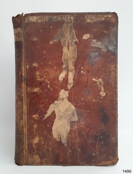 Burgundy hardcover with gold embossed letters on spine. Pasted clippings are on cover and sping.