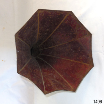 Octagonal shape of horn's opening is scalloped between the eight seams