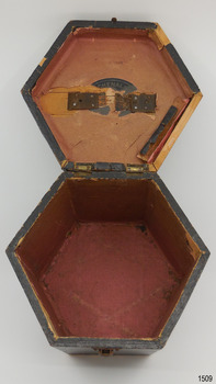 Remains of a label inside lid, and showing cromson coloured lining in base