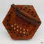 End of concertina showing cutout wood, buttons  and leather handle 