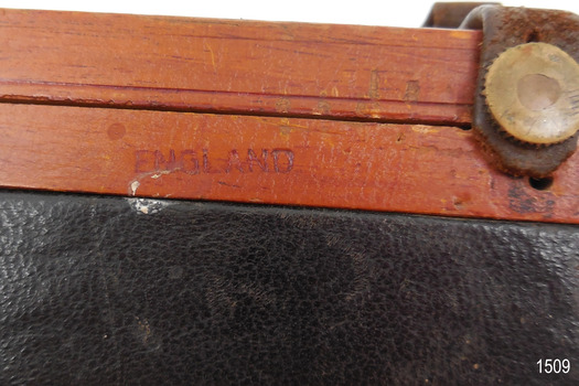 Close-up of stamped name in timber