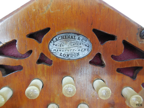 Close-up of maker's name on oval badge