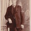 Photograph of a male in naval uniform, presented as a postcard