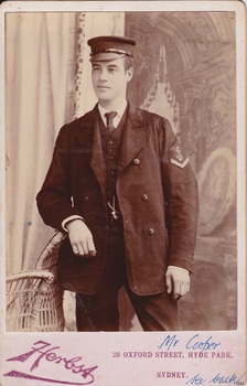 Photograph of a male in naval uniform, presented as a postcard