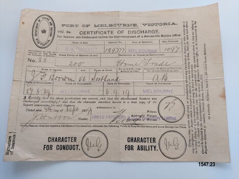 Certificate of Discharge with name of seaman, ship, date and other particulars filled in by hand with ink