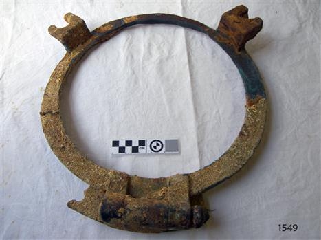 Brass porthole frame has remnants of fittings. It is heavily encrusted.