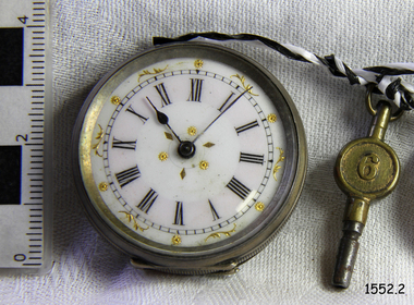 Decorative metal case and face, with watch key