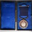 Case has built-in hook to hold medal in place. The reverse side of the medal is uppermost.