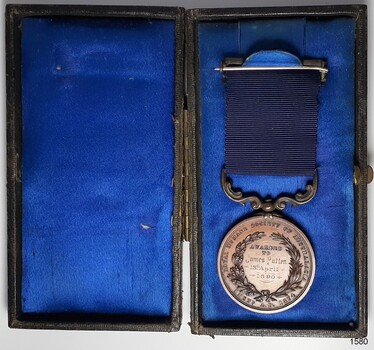Case has built-in hook to hold medal in place. The reverse side of the medal is uppermost.