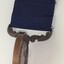 Medal is swivelled to show the edge, which is smooth.