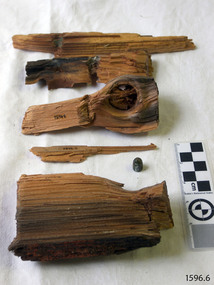 Several pieces of broken timber, and a bullet that was found within the timber
