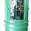 Round green metal cabinet with a wheel on top, glass doors, and mechanical equipment inside.