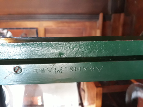 Inscription is embossed on the metal frame of the apparatus