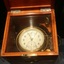 Chronometer face has two small dials on the larger face. The face has analogue numbers.