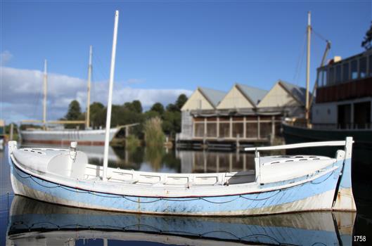Photograph shows mast, tiller and rudder.
