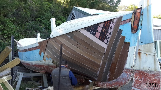 Boatbuilder restoring lifeboat's double planking