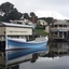 Lifeboat Warrnambool, painted white and blue, on the lake beside the Rocket House