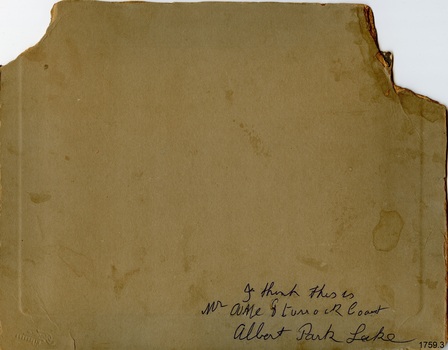 Handwritten blue text  with a name and location