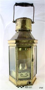 Brass lamp with three glass windows and wood and metal folding carry handle