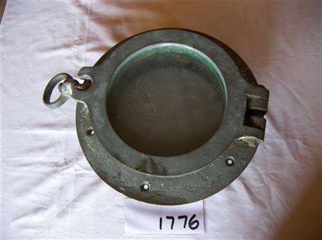 Metal porthole frame with glass window