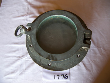 Metal porthole frame with glass window