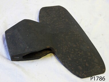 Metal T-shaped axe head with formed slot for adding the handle