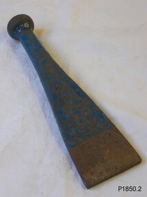Metal tool with round knob on handle and flared out blade