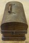 Handle on case folds, clips on sides fold upwards, the crank handle fits into the socket on the side.