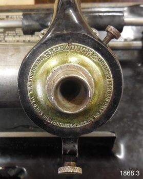 The metal reproducer has and inscription. It is a needle, amplifier and speaker.