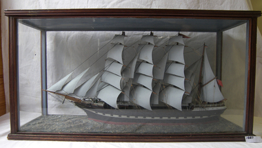 Four-masted ship model in glass and timber case