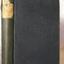Navy blue textured hardcover with title on label on spine