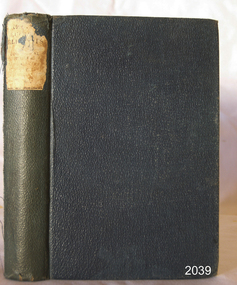 Navy blue textured hardcover with title on label on spine