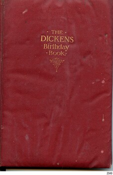 Crimson book with gold embossed title on the cover