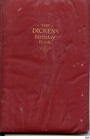Crimson book with gold embossed title on the cover