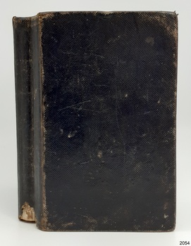 Black fabric hardcover book with shiny textured surface