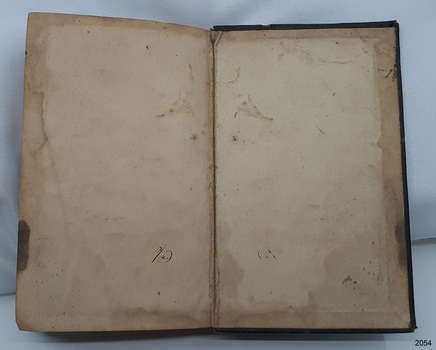 Water damage around all sides. Handwritten black ink characters