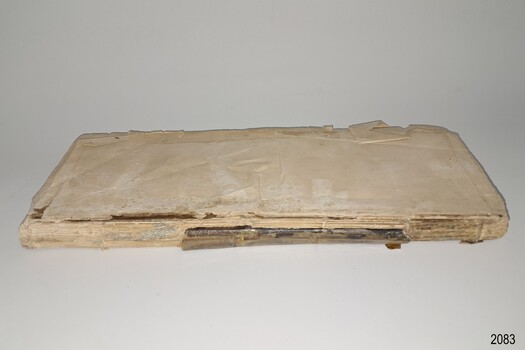 Spine and front page of coverless book, in poor condition