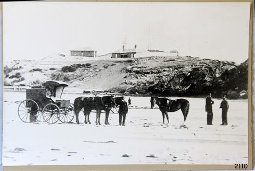 Lighthouse Complex in background, carriage, horses and figures in foreground